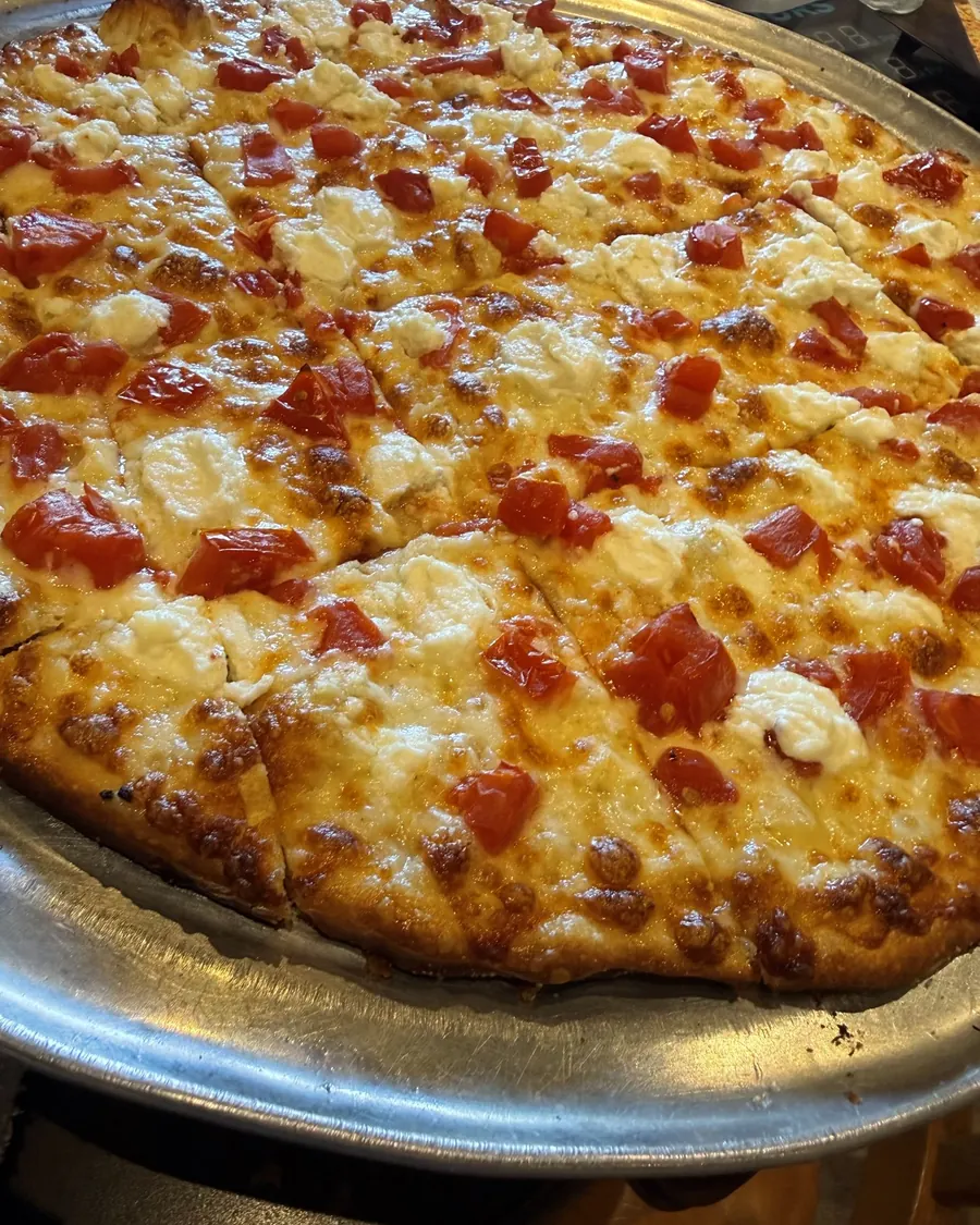 A personal tavern-style cheese pizza on a tray